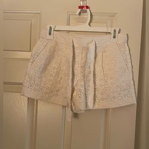 Eyelet shorts with elastic waistband.